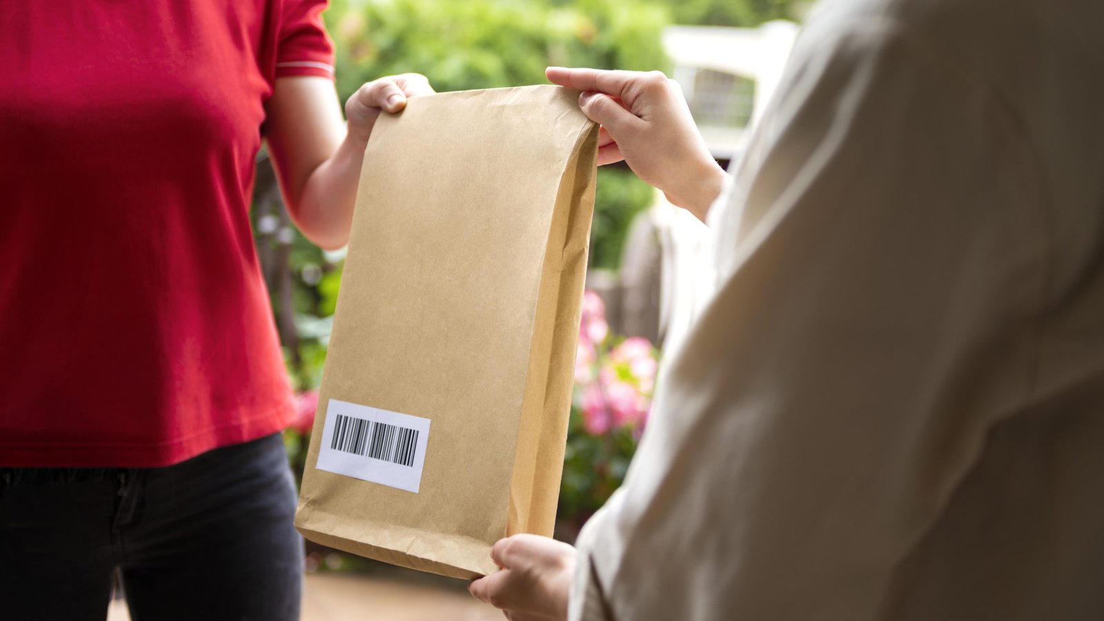 Express courier handing over a parcel to a customer